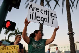 ‘Are critics illegal?’ one protester asks